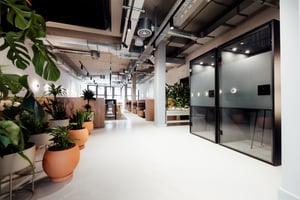 Acoustic pods and planting in an open-plan workspace, installed by JPA
