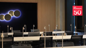 Study desks with lamps furnished by JPA Workspaces, with the JPA Workspaces 50 years badge